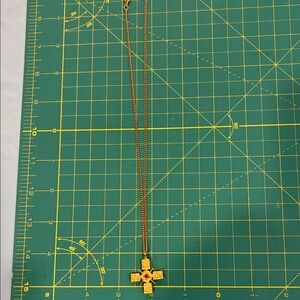Ornate Gold Cross Necklace with Red Accent